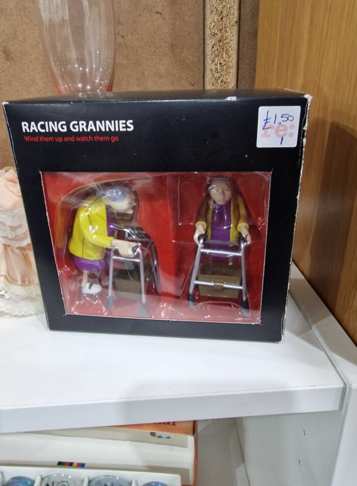 Box of "Racing Grannies" in a secondhand shop, featuring two wind-up toy figures with walkers.