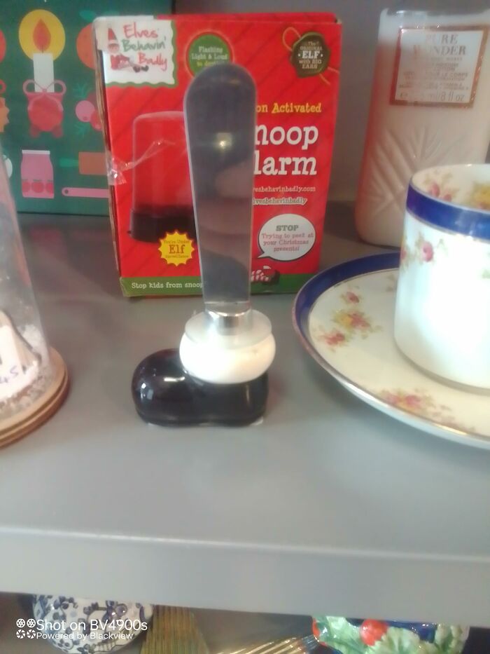 Unusual knife holder shaped like a boot, found at a secondhand shop, displayed with various vintage items.