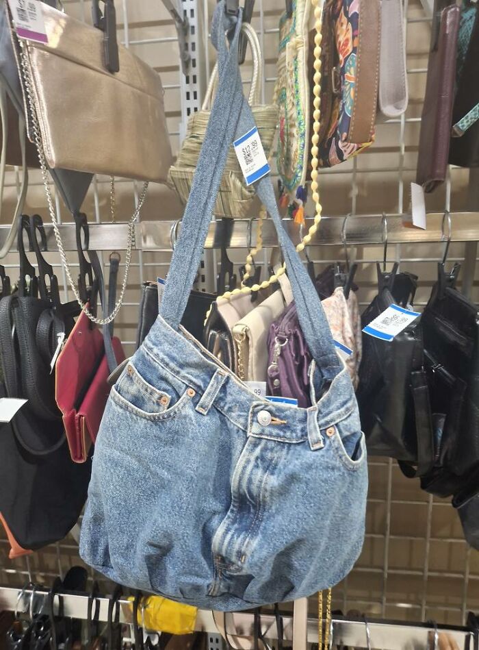 Denim bag shaped like jeans in a secondhand shop, showcasing bizarre treasures found in thrift stores.