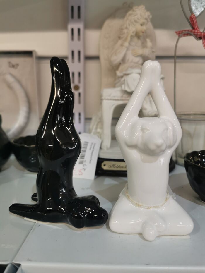 Bizarre treasures found in secondhand shop: unique black and white ceramic sculptures on display.