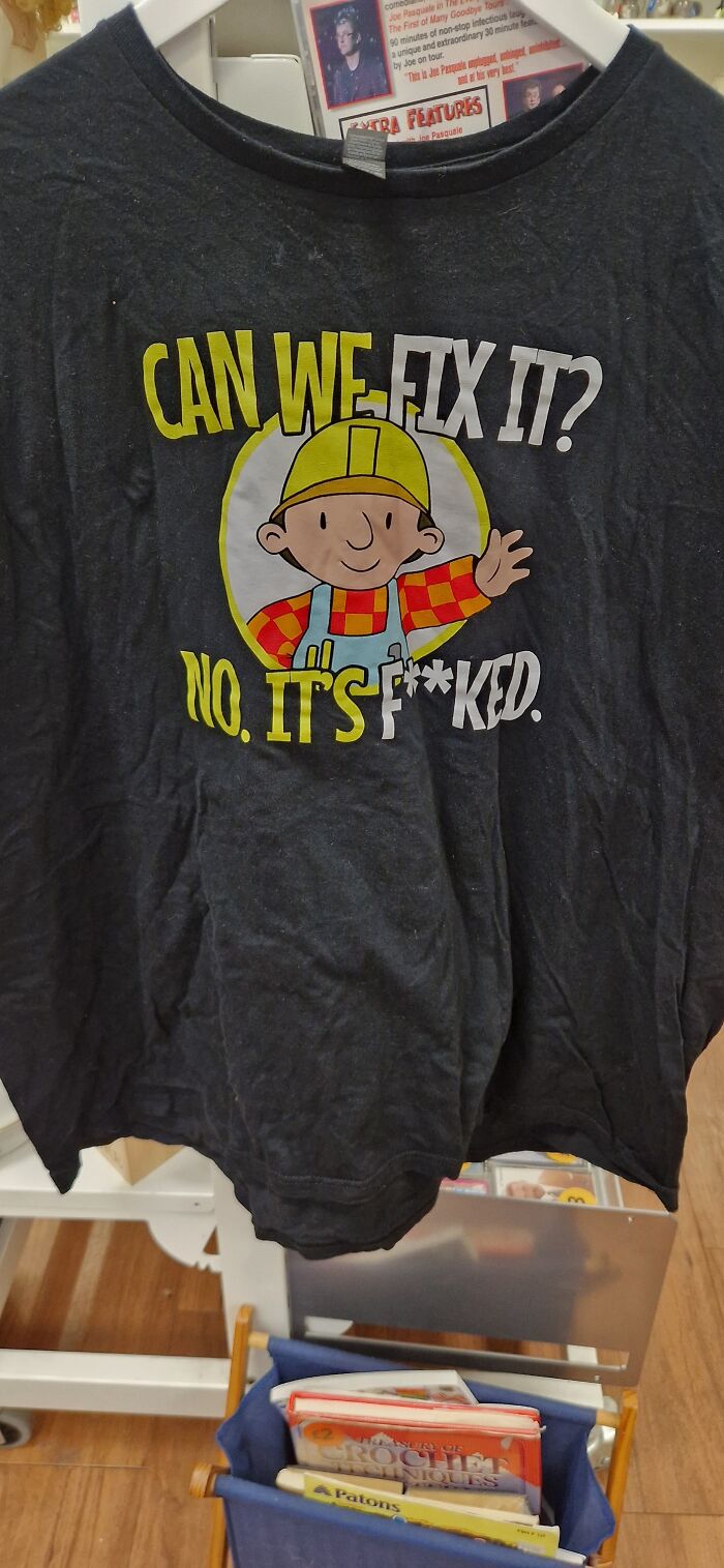 Bizarre treasure: T-shirt with cartoon character and humorous text, found in secondhand store.