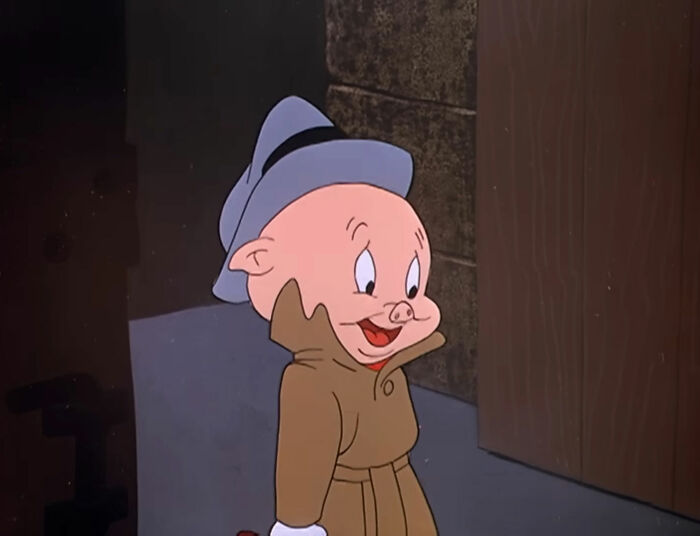 Cartoon pig character in a trench coat and hat, illustrating random knowledge.