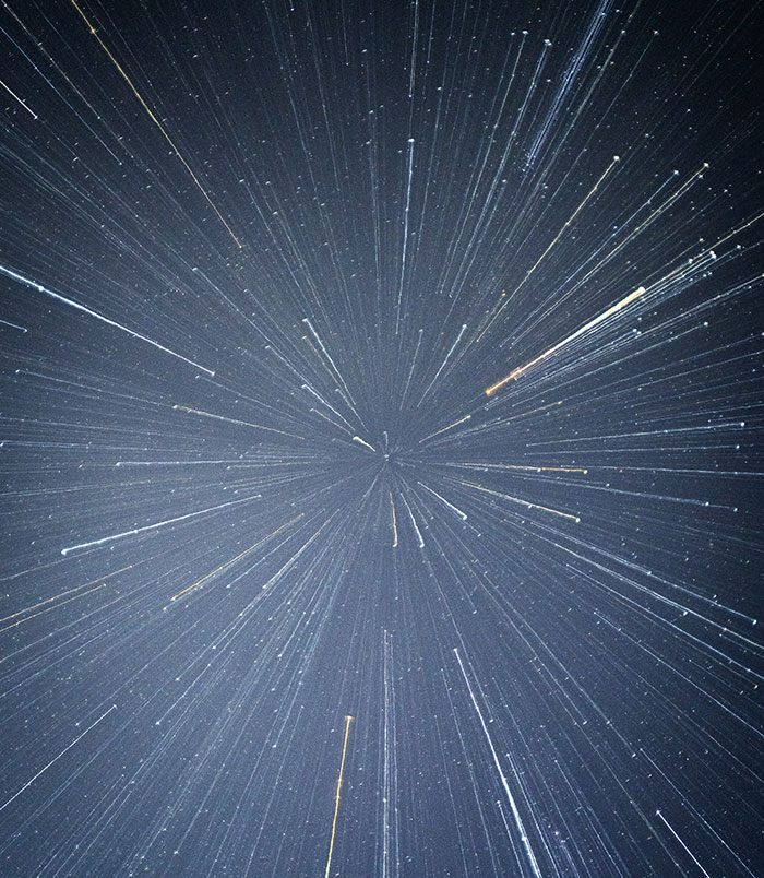 A dazzling display of star trails in a night sky, showcasing fascinating science.