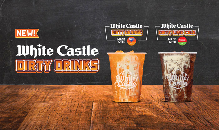 White Castle showcases new Dirty Drinks, featuring Dirty Orange and Dirty Lime Cola, on a wooden table. White Castle showcases new Dirty Drinks, featuring Dirty Orange and Dirty Lime Cola, on a wooden table.