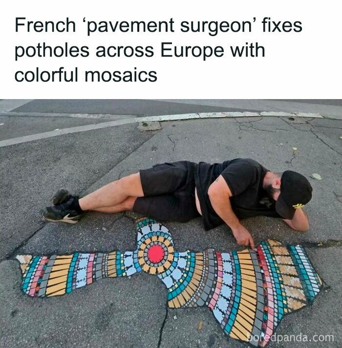 Man installing colorful mosaic in a pothole on pavement, bringing positive vibes and creativity to urban streets.