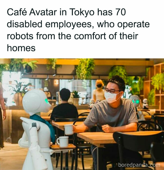 A person in a cafe served by a robot operated by remote employees, illustrating a positive and innovative work model.