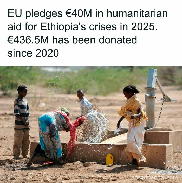 Children playing with water from a pump in Ethiopia, connected to positive humanitarian aid news.