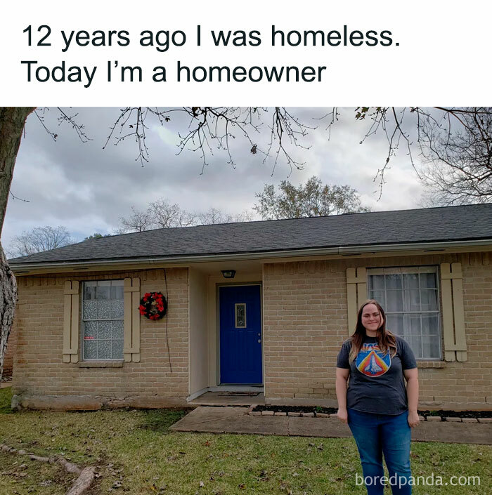 Woman standing proudly in front of her new home reflecting a wholesome meme about overcoming homelessness.