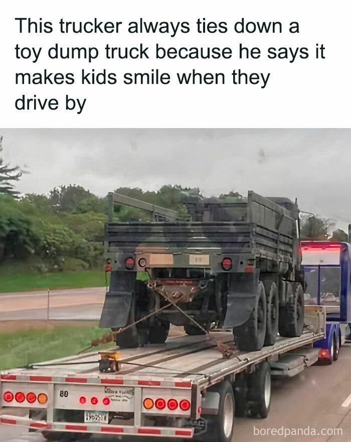 Trucker ties down toy dump truck on flatbed to make kids smile driving by wholesome memes.