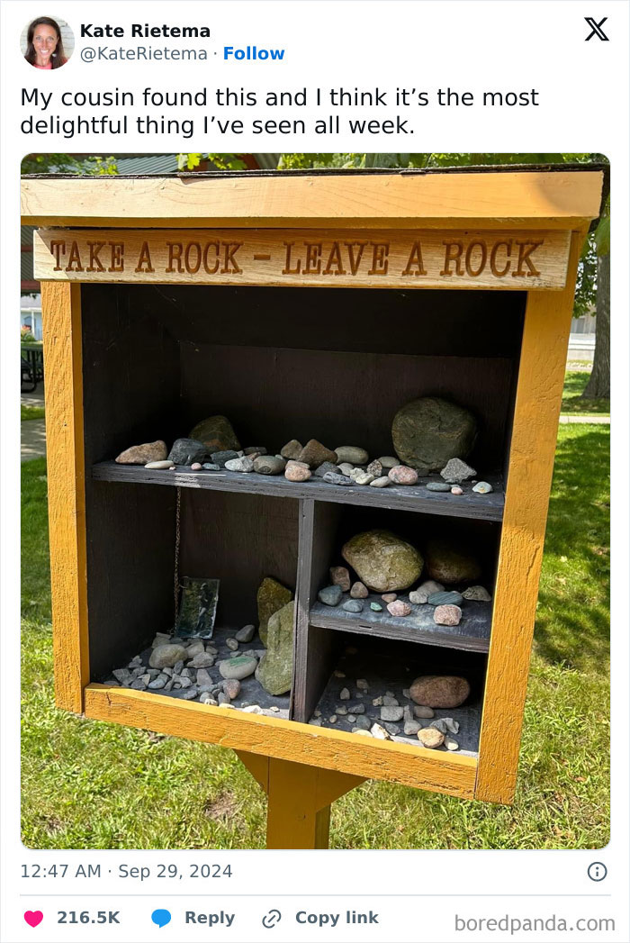 Take a rock leave a rock wooden box filled with stones, a pure and uplifting moment in daily scroll inspiration.