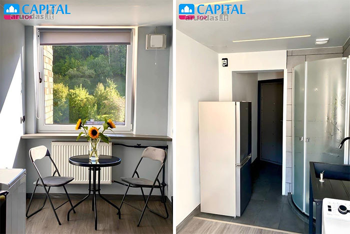 Modern minimalist interior of a wild real estate property featuring a small dining area and compact kitchen space.