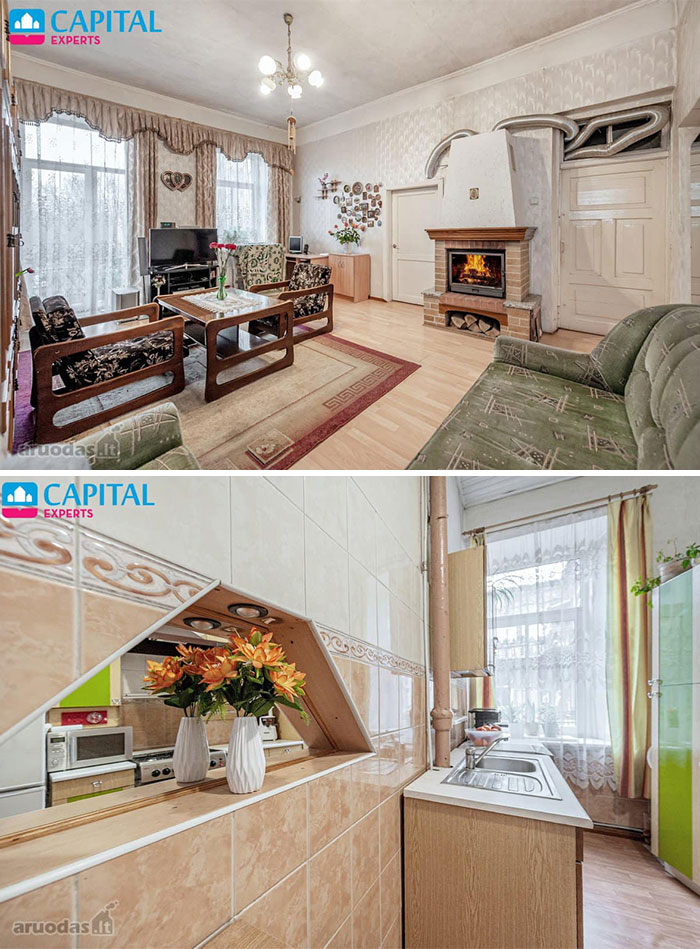 Living room with vintage furniture and fireplace, and kitchen with tiled walls in unique real estate property for sale.