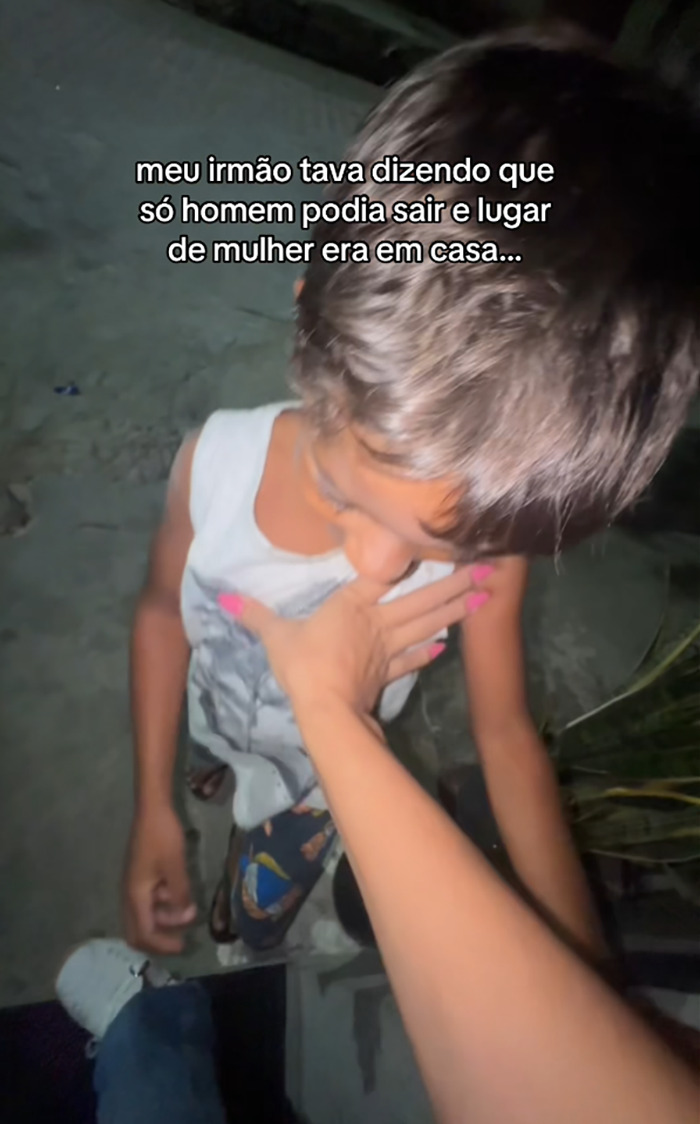 Young boy locked outside by woman teaching lesson on gender roles with main SEO keywords men can go out women stay home Young boy locked outside by woman teaching lesson on gender roles with main SEO keywords men can go out women stay home