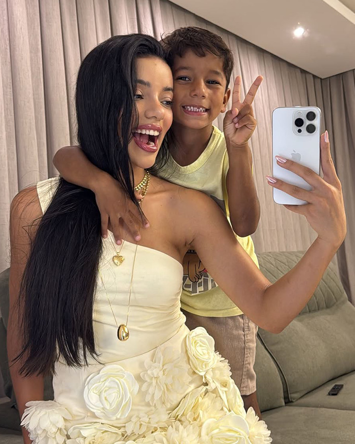 Woman and little brother taking a selfie indoors, representing the lesson about men going out and women staying home. Woman and little brother taking a selfie indoors, representing the lesson about men going out and women staying home.