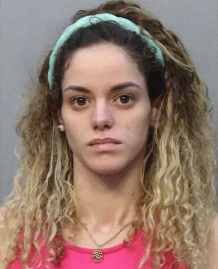 A woman with curly hair and a headband, unsmiling, against a plain background, related to toddlers' safety incident. A woman with curly hair and a headband, unsmiling, against a plain background, related to toddlers' safety incident.