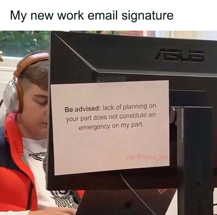 Person with headphones at desk, computer displaying a work meme about planning and emergencies.