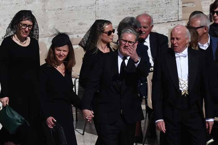World leaders in black attire at Pope Francis’s funeral, some looking solemn, others conversing. World leaders in black attire at Pope Francis’s funeral, some looking solemn, others conversing.