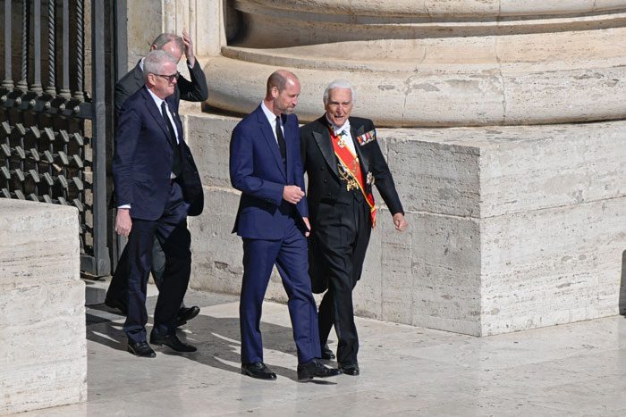 World leaders at Pope Francis’s funeral, two in formal suits, one in a ceremonial uniform with medals, walking outside. World leaders at Pope Francis’s funeral, two in formal suits, one in a ceremonial uniform with medals, walking outside.
