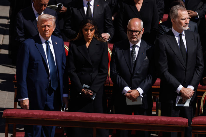 World leaders stand solemnly at Pope Francis’s funeral, dressed in formal black attire under bright sunlight. World leaders stand solemnly at Pope Francis’s funeral, dressed in formal black attire under bright sunlight.