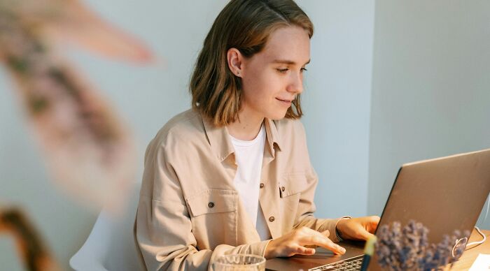 Young woman focused on visual trivia challenge, trying to pick the right color in a logic-based online game. Young woman focused on visual trivia challenge, trying to pick the right color in a logic-based online game.