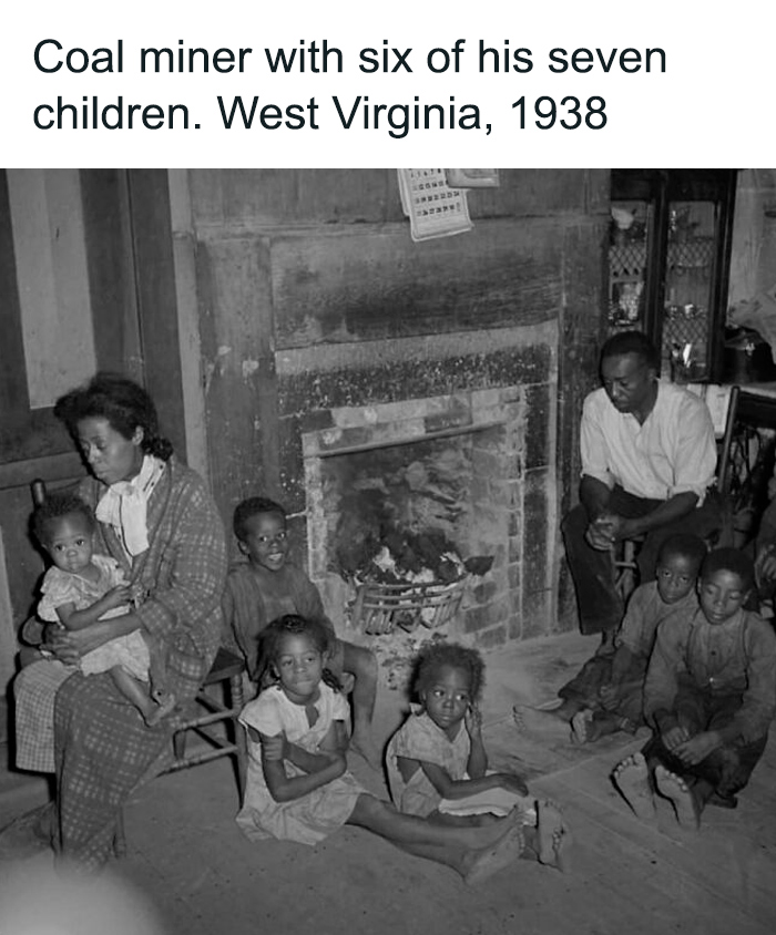 Coal miner and six children sitting by fireplace in West Virginia, capturing monumental life moments frozen in time, 1938.