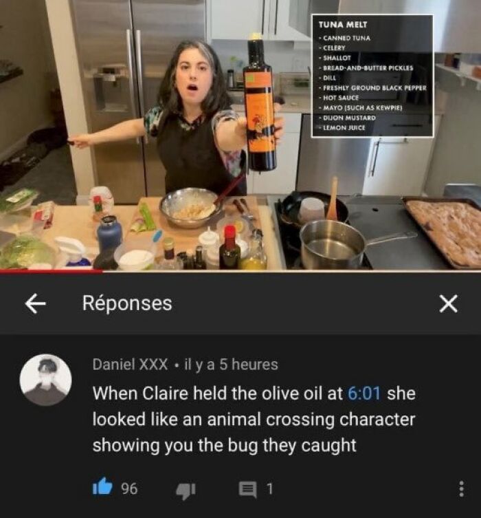 Woman in kitchen holding olive oil bottle humorously, with chaotic meme comment about animal crossing character showing a bug.