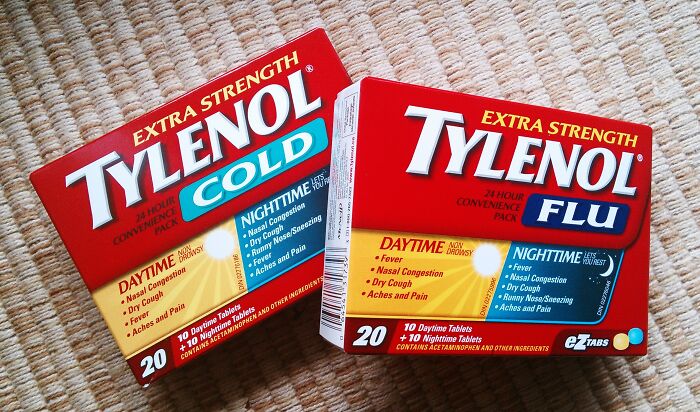 Tylenol cold and flu medicine boxes on a carpet, highlighting casual items that can actually be deadly.