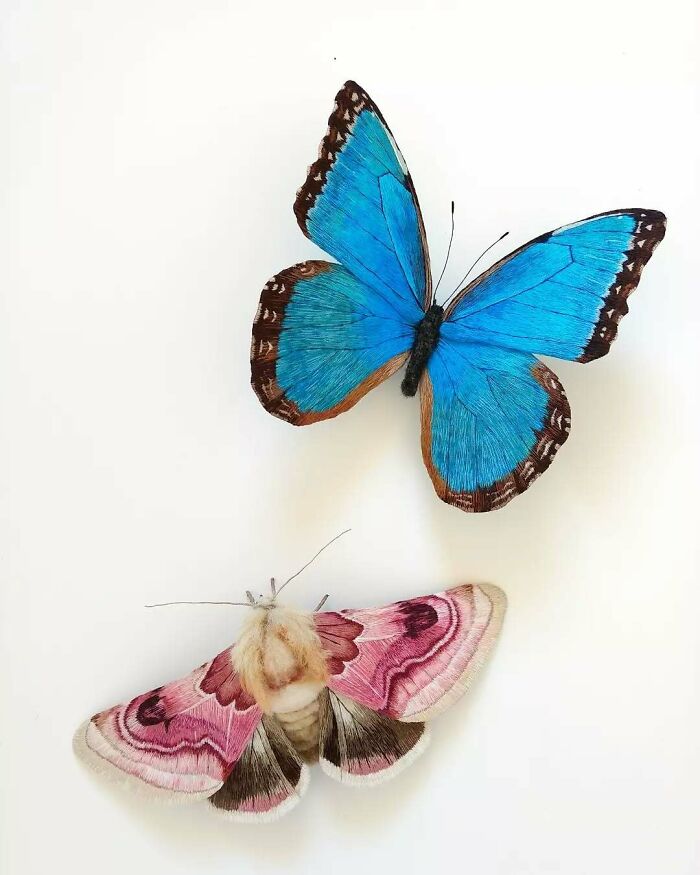 Blue embroidered fiber butterfly and pink moth artwork by Yumi Okita showcasing detailed textile craftsmanship.