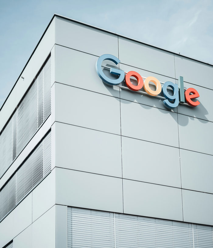 Modern office building with Google logo, related to former employees revealing disturbing workplace secrets after quitting jobs.