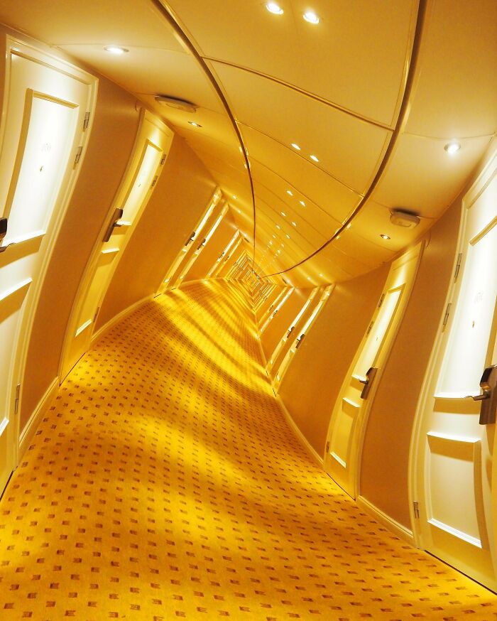 Distorted hallway with warped walls and ceiling creating a creative photo edit that makes you question reality.