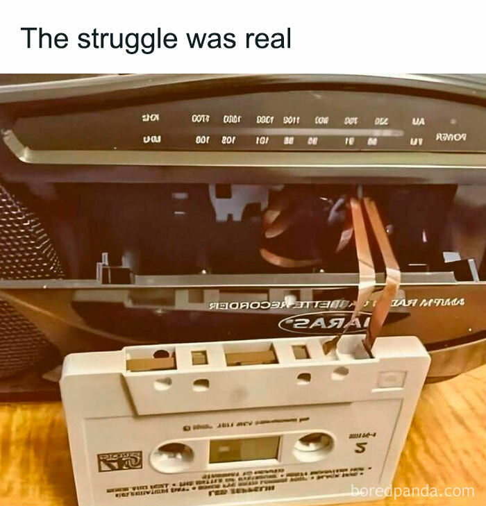 Old cassette tape with tangled tape in a vintage boombox, celebrating nostalgia from the good old 80s era.