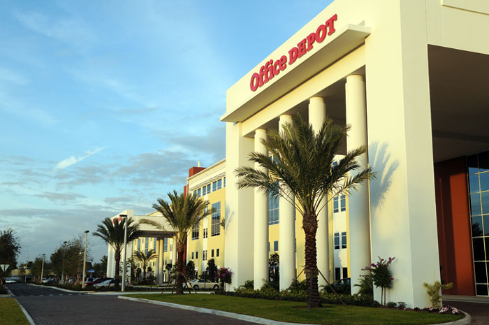 Office Depot building exterior with palm trees, relating to former employees revealing disturbing workplace secrets.