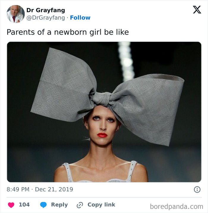 Model on runway wearing an oversized gray bow representing funny parenting memes that are painfully relatable.