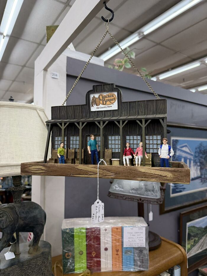 Miniature Cracker Barrel Old Country Store hanging decor with figurines found among thrifted finds that are weird and wonderful.