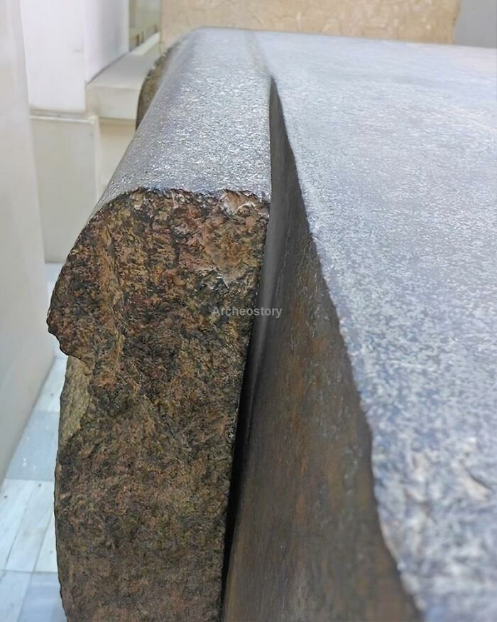 Close-up of an ancient stone artifact showcasing detailed weathered texture and craftsmanship from ancient history.