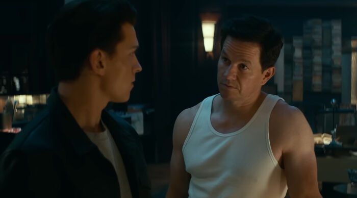 Two actors in a dimly lit room, representing notable miscast actors who almost ruined popular movies.