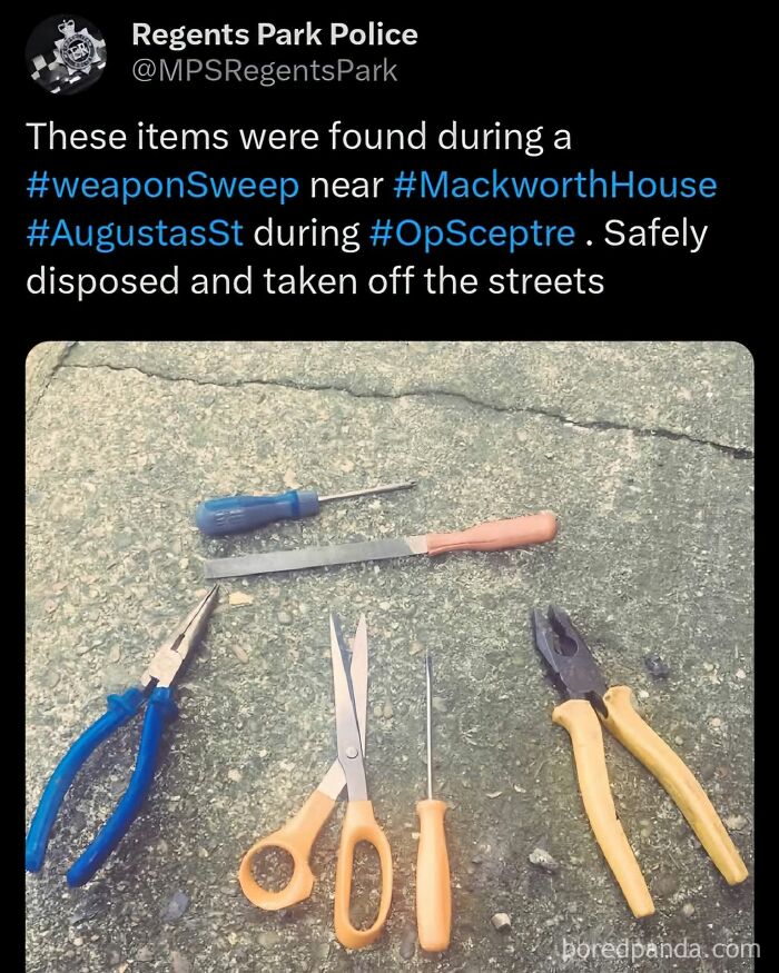 Tools including pliers, scissors, and screwdrivers displayed on pavement during a weapon sweep operation.