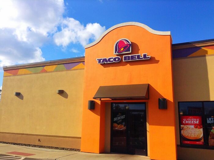 Taco Bell restaurant exterior under a blue sky, illustrating a common setting related to Boomer opinions people agree with.