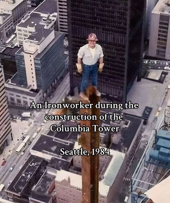 Ironworker standing on a steel beam high above Seattle during construction, monumental life moment frozen in time, 1984.