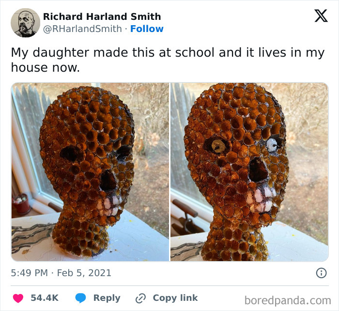 Detailed creepy skull sculpture made from honeycomb cells displayed on a windowsill, showcasing eerie and unsettling art.