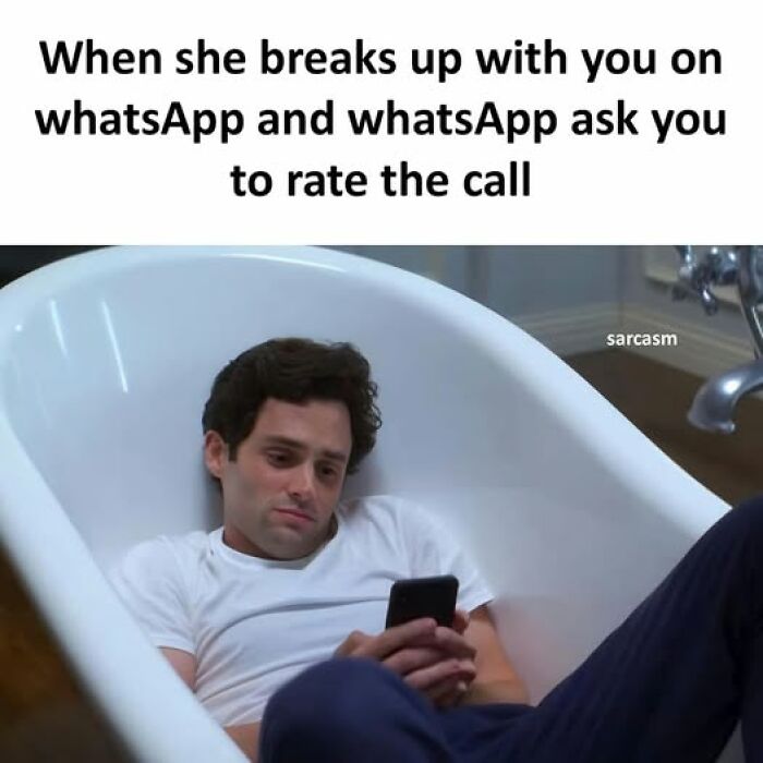 Man lying in bathtub looking at phone, illustrating hilarious memes from a popular Facebook page about funny posts.