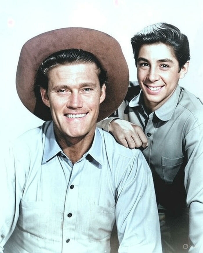 Black and white photo colorized showing two smiling men in vintage clothing revealing a side of history not in textbooks