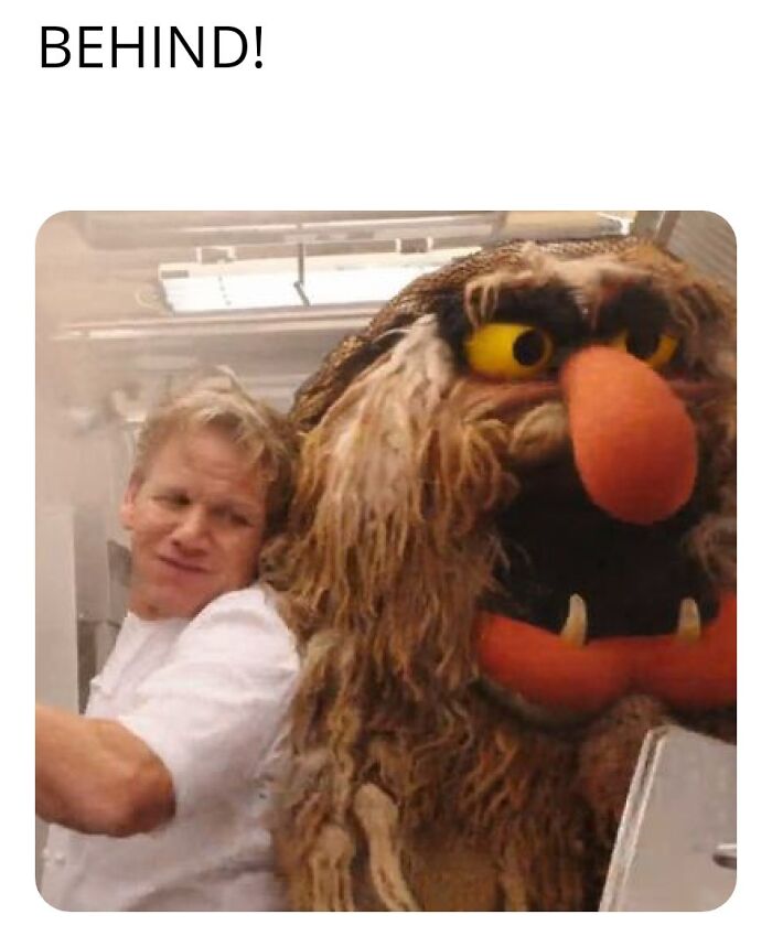 Chef Gordon Ramsay in a kitchen, reacting with surprise to a large monster figure, hospitality work meme.