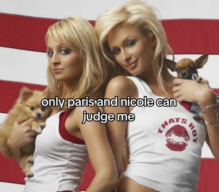 Two women holding small dogs in front of an American flag background, featuring cute and wholesome posts.