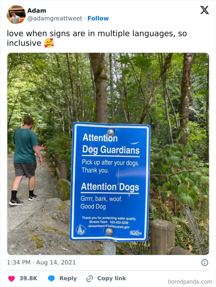 Blue sign in a forest with funny dog message, perfect for memes about being one inconvenience away from a meltdown.