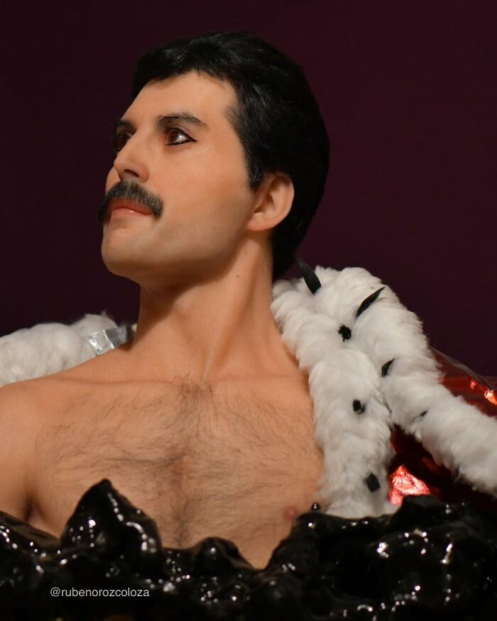 Hyper-realistic sculpture by Ruben Orozco Loza depicting a man with a mustache wearing a fur-lined cloak.