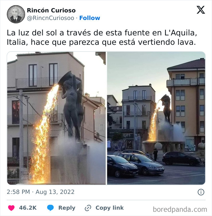 Fountain in L'Aquila, Italy with sunlight creating an illusion of lava pouring from statue, a curious double take moment.