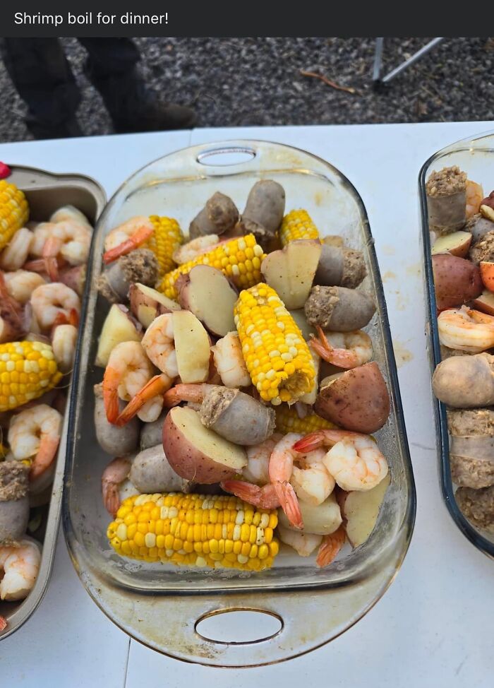 Glass dish filled with shrimp, corn on the cob, sausage, and potatoes in a seafood boil, cursed food pics trigger warning.