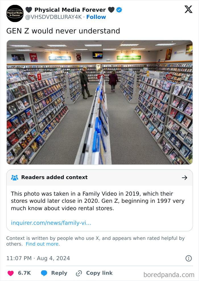 Interior of a nostalgic video rental store with rows of DVDs, showing rose tinted tolerance for past media culture.
