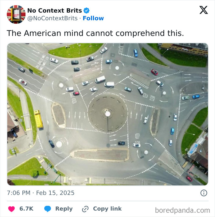 A complex multi-lane roundabout with unusual road markings confusing to the American mind.